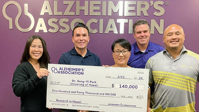 group photo with Alzheimer's Association sign in back